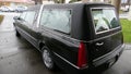 Hearse arriving or leaving a funeral due to the Increasing death from Corona virus and Covid 19 pandemic outbreak