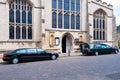 Hearse carrying a coffin parked outside church