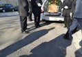 Hearse with coffin and gravediggers