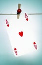 Heart ace hanging on a rope Royalty Free Stock Photo