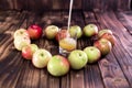 Heart of apples on brown wooden background. Apple juice on wooden table Royalty Free Stock Photo