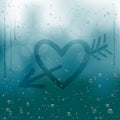 Heart with arrow draw on rainy window Royalty Free Stock Photo