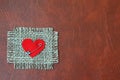 Heart attached on canvas with safety pin Royalty Free Stock Photo