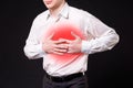 Heart attack, man with chest pain on black background