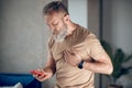 A midaged bearded man having a heart attack Royalty Free Stock Photo