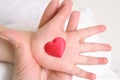 Heart in baby`s hand Royalty Free Stock Photo