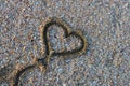 Heart balloon shape drawn at the beach