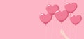 Heart balloons and a hand holding one on a pink background, copy space. Flat vector illustration Royalty Free Stock Photo