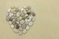 Heart of beach stones on a sandy beach Royalty Free Stock Photo