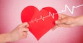 Heart beat over hands holding heart Royalty Free Stock Photo