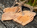 The heart of birch bark on a wooden background. Manual work in design Royalty Free Stock Photo