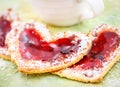 Heart biscuits with jam and tea