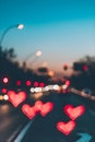 Heart bokeh background, night city lights. Heart shape bokeh from street light. City in love. Valentine\'s Day Royalty Free Stock Photo