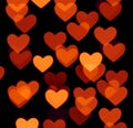 Heart bokeh background, photo blurry objects, brown red on black Royalty Free Stock Photo