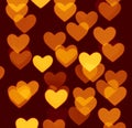 Heart bokeh background, photo blurry objects, yellow on dark brown Royalty Free Stock Photo