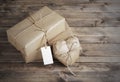 Heart and box wrapped in brown kraft paper with a price tag, on