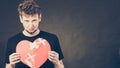 Sad man with glued heart by plaster. Royalty Free Stock Photo