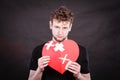 Sad man with glued heart by plaster. Royalty Free Stock Photo