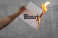 Heart burn text on burning paper Royalty Free Stock Photo