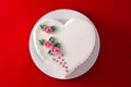 Heart cake for St. Valentine`s Day, Mother`s Day, or Birthday, decorated with roses and pink sugar hearts Royalty Free Stock Photo