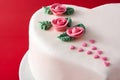 Heart cake for St. Valentine`s Day, Mother`s Day, or Birthday, decorated with roses and pink sugar hearts Royalty Free Stock Photo