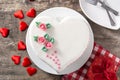 Heart cake for St. Valentine`s Day, Mother`s Day, or Birthday, decorated with roses and pink sugar hearts Royalty Free Stock Photo