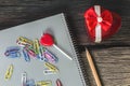 Heart candle with note pad, pencil, paper clip, computer, heart Royalty Free Stock Photo