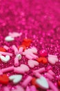 Heart candy confetti, pearl on purple sparkle background. 14 february, valentines day macro love card Royalty Free Stock Photo