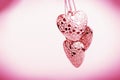 Heart on chain. Three pink hearts. Valentine`s Day holiday. Pink hearts for lovers girls and women