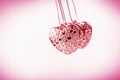 Heart on chain. Three pink hearts. Valentine`s Day holiday. Pink hearts for lovers girls and women