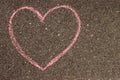 heart in chalk on the asphalt, children's drawing on the sidewalk Royalty Free Stock Photo