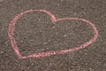 heart in chalk on the asphalt, children's drawing on the sidewalk Royalty Free Stock Photo