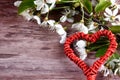 Heart with cherry blossoms on wooden desk Royalty Free Stock Photo