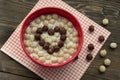 Heart of chocolatel balls with milk Royalty Free Stock Photo
