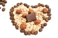 Heart of coffee beans, chocolate, peanuts and hazelnuts Royalty Free Stock Photo
