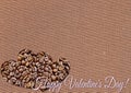 Heart of coffee beans for Valentine`s Day - February 14. Conceptual background with space for greeting text. Royalty Free Stock Photo