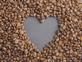 Heart coffee frame made of coffee beans on burlap texture Royalty Free Stock Photo