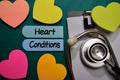 Heart Conditions write on sticky note isolated on Office Desk. Healthcare or Medical Concept