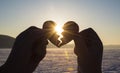 Heart connect the hands of lovers, silhouette at sunset, the day of all lovers Royalty Free Stock Photo