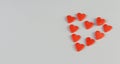 heart consists of little red hearts on a blue background place for text