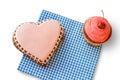 Heart cookie and pink cupcake.