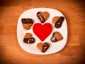 Heart cookies on a wooden brown background. Concept of Holiday Valentine`s Day or Christmas and New Year.