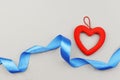 Heart decoration red with a blue ribbon bow