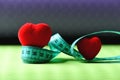 Heart decorations and flexible ruler lying on yoga mat Royalty Free Stock Photo