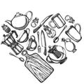 Heart design with black and white Chef`s knifes, teaspoon, spoon, fork, knife, cutting board, bottle of oil, teapots Royalty Free Stock Photo