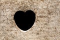 Heart on dirt wall