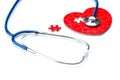 Heart disease, puzzle heart with stethoscope Royalty Free Stock Photo