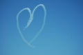 Heart. Drawing by airplane vapor contrail in blue sky