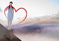 Heart drawing and Businesswoman standing on Roof with chimney and colorful sky Royalty Free Stock Photo