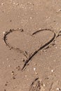 Heart drawn on beach sand. love background, valentine day, happy holiday, or wedding